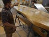 Luke Allen points to a student-made table that will be installed upon completion at Fairfield Warde.