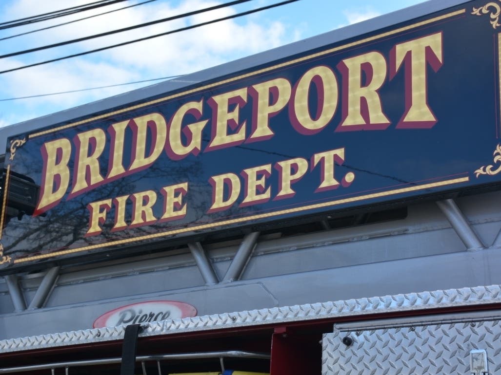 Bridgeport firefighters battled a two-alarm fire on Friday that displaced six people, according to fire officials. No injuries were reported.