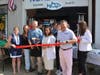 Jardar Nygaard, owner of Nordic Fish in downtown Fairfield, stands next to First Selectperson Christine Vitale during a seventh anniversary ribbon-cutting ceremony on Wednesday.