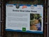 A sign near the litter boom in the Rooster River in Fairfield that describes the project.