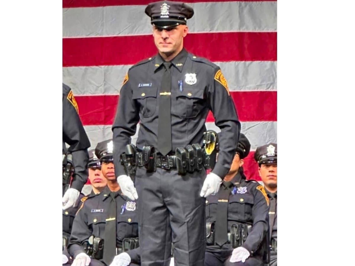 Bridgeport Police Officer Cooper Whiteside, shown here at graduation from the Police Academy, was killed in a motorcycle crash early Monday in Danbury, according to police. The passenger on the bike, New Milford resident Brittany Islami, was also killed.