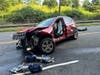 Three people were hospitalized Sunday after this vehicle smashed into a guardrail Sunday near Connecticut Avenue and Elmcrest Terrace, according to fire officials.