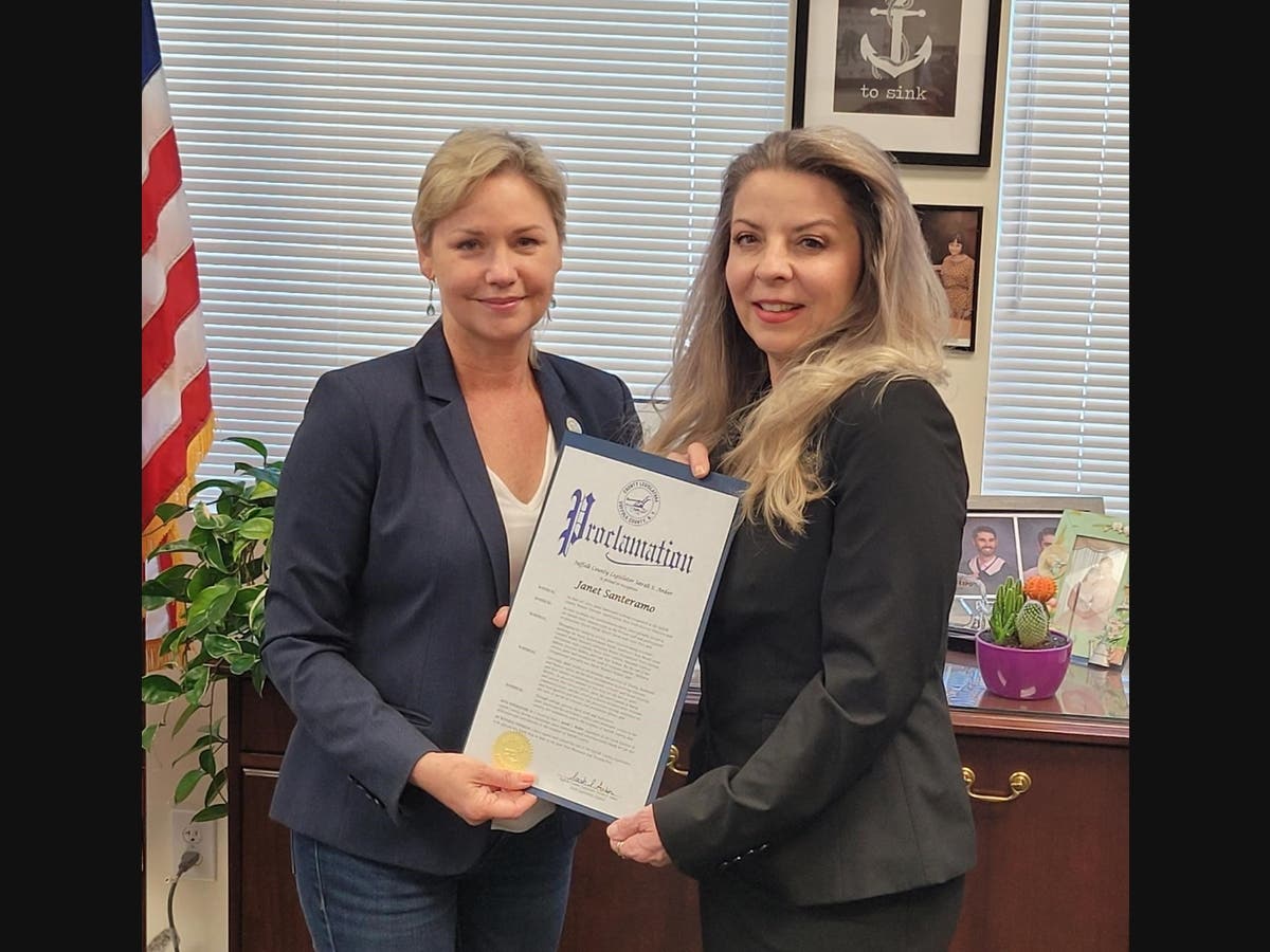 Pictured: Suffolk County Legislator Sarah Anker presents a proclamation to Marine Corps Veteran Janet Santeramo