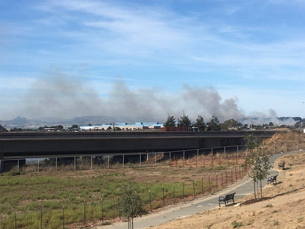 Smoke from a brush fire at Point Isabel on Thursday.
