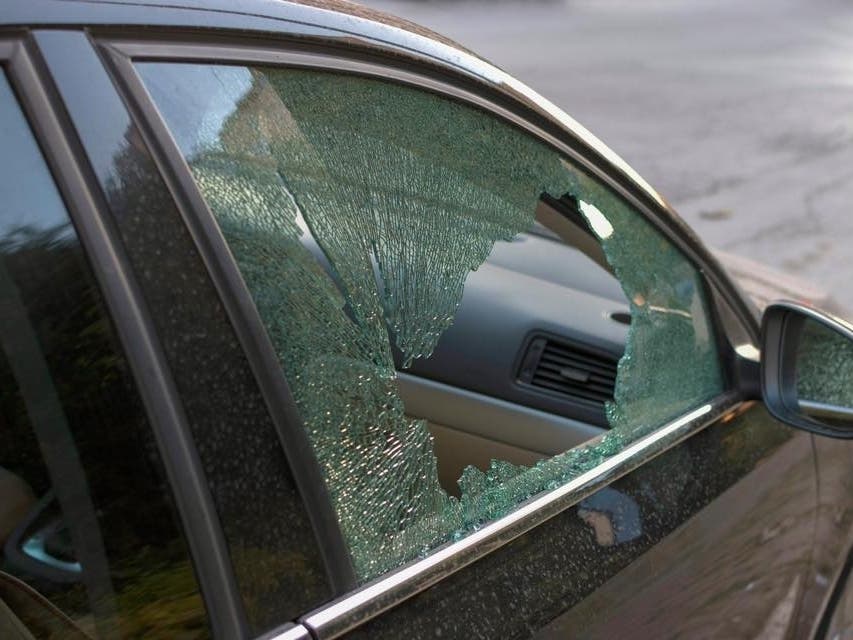 The thieves busted out windows during the night looking for stuff to steal.