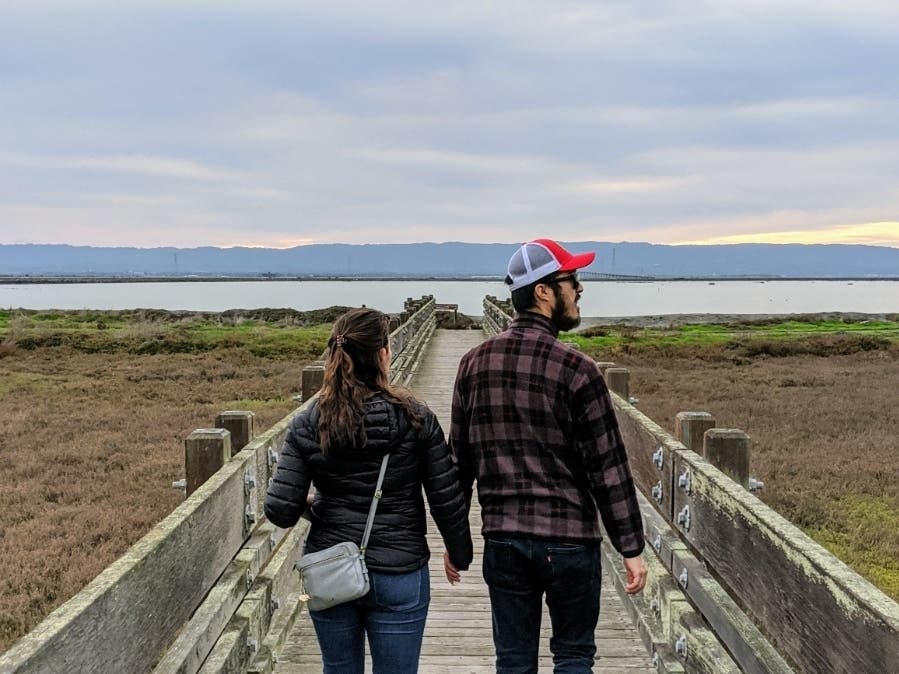 Walking toward San Francisco Bay along a boardwalk in Fremont, Calif.