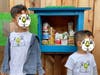 Isaac and Anthem Au, aged 5 and 2 ½ years old, participate in Little Free Pantry program.