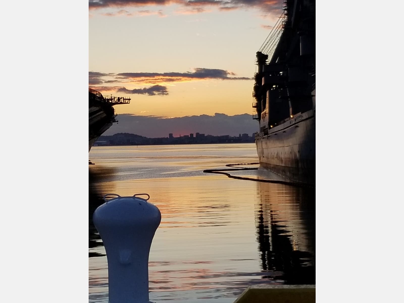 Ships in San Francisco Bay at sunset. Photo taken at Alameda, Calif.