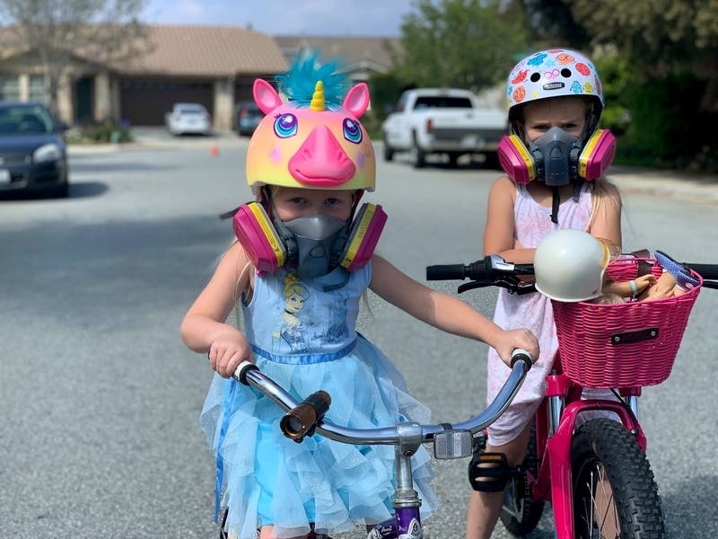 Two sisters riding their bikes during coronavirus precautions in California.