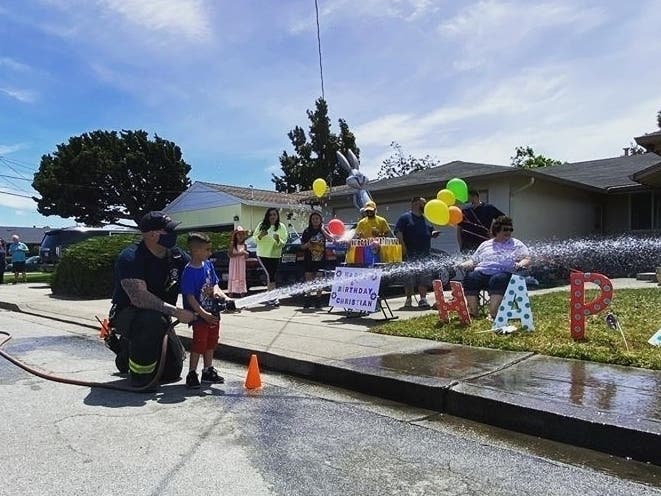 Birthday celebration, with the fire department, in San Leandro, Calif.