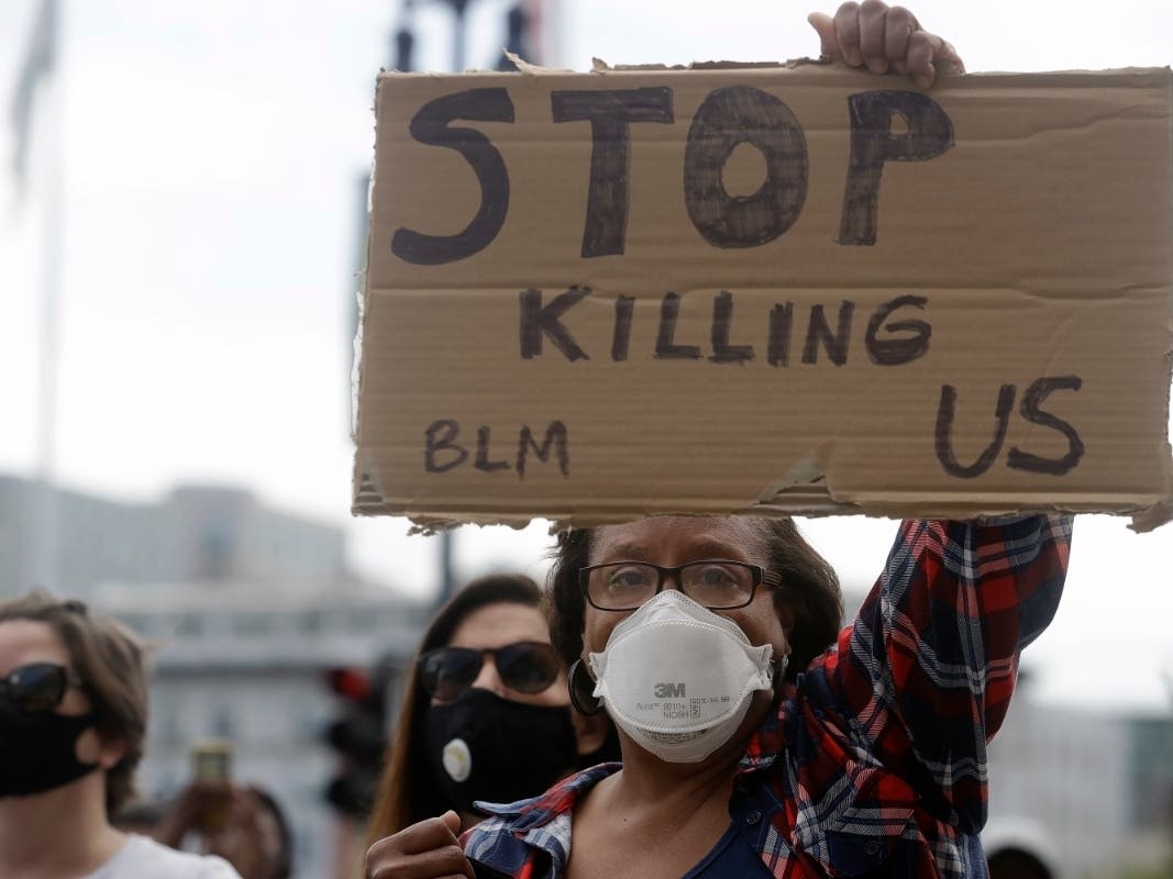 The protesters, like those pictured, oppose violence by police against blacks.