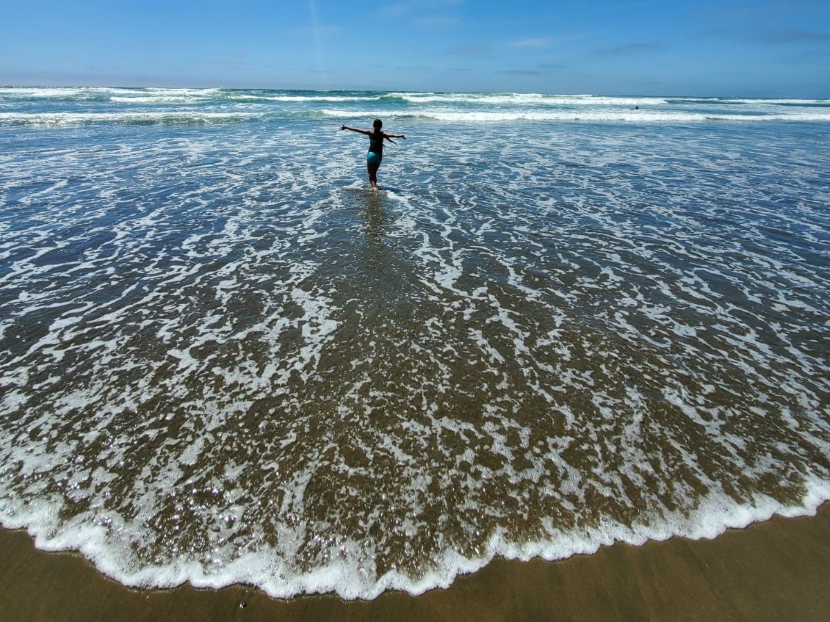 Candid photo of a 9-year-old girl at the beach in San Francisco, Calif.