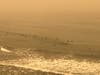 Smoky skies over surfers, San Francisco.