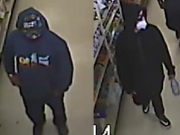 Two men robbed a gas station attendant at gunpoint.