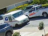 A USPS truck is burglarized, with a stolen pickup truck beside it.