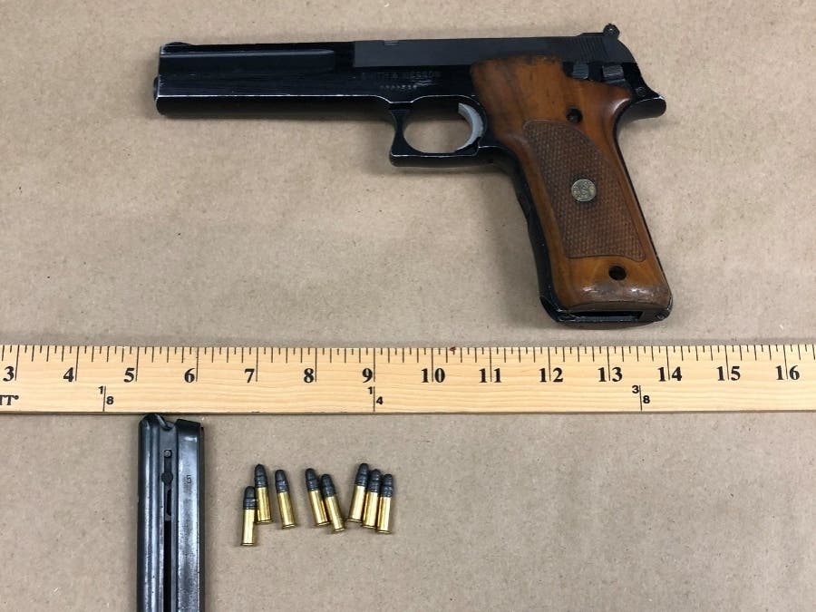 Gun and bullets taken from suspect, according to police.