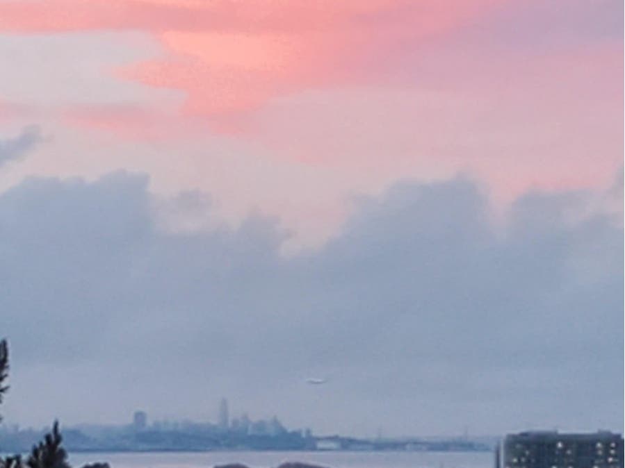 The San Francisco skyline beneath a rosy sky.