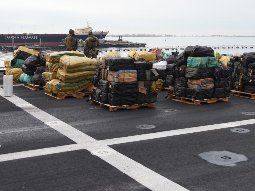 U.S. Coastguardsmen with Law Enforcement Detachment 407 (LEDET) offloads 11,400 pounds of cocaine and 9,000 pounds of marijuana in San Diego, Feb. 1, 2021. They were seized in international waters of the Eastern Pacific Ocean and are worth $211M. 