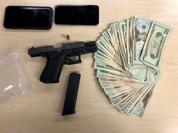 Gun, cash, and cell phones that were in possession of the arrested person, according to police.