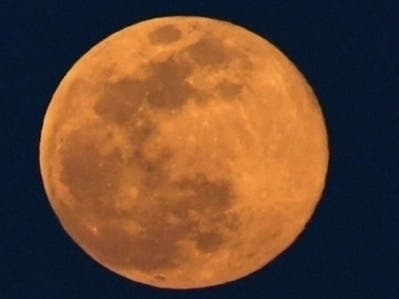 Monday's full super pink moon is the first of three consecutive supermoons in 2021. April's full moon is called the pink moon because that's when the wild phlox blooms. 