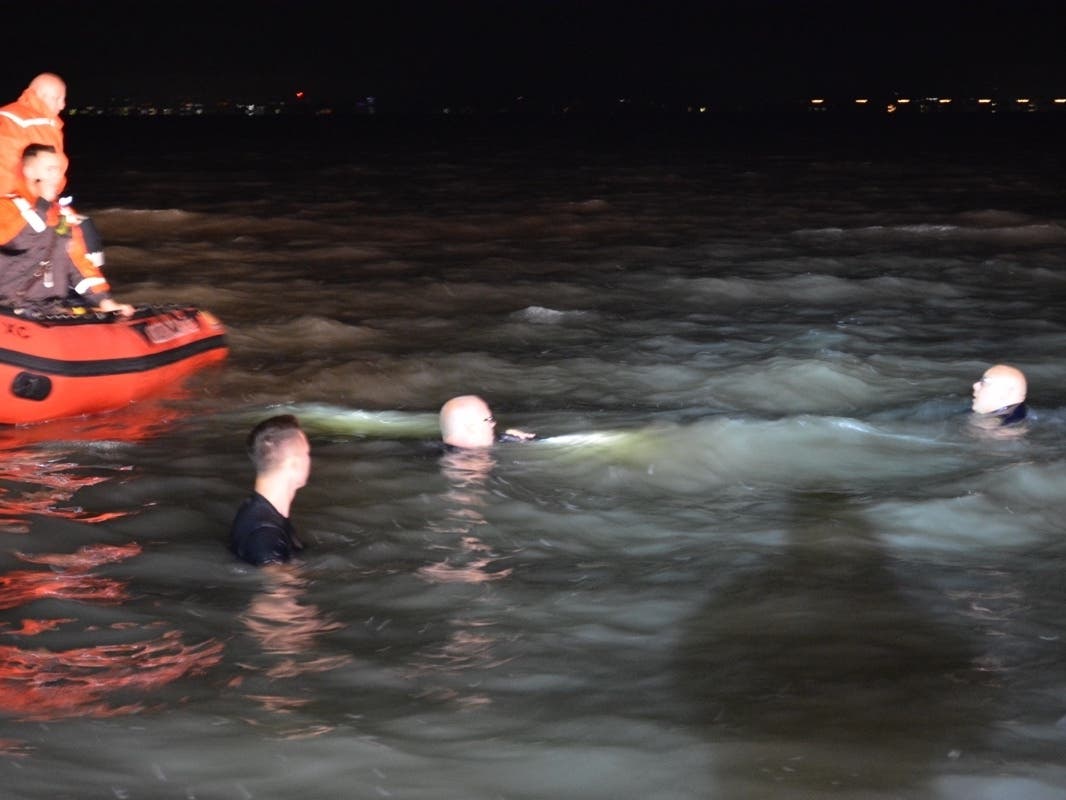 Police officers went into the water in an attempt to save the woman before the fire department water rescue team arrived.