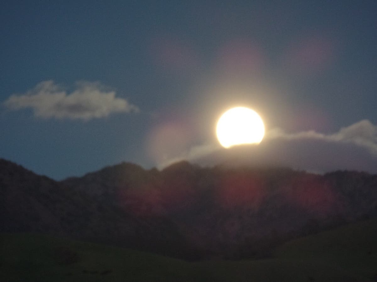 A full moon rises over Mt. Diablo, Calif.