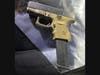 Handgun confiscated during arrest.
