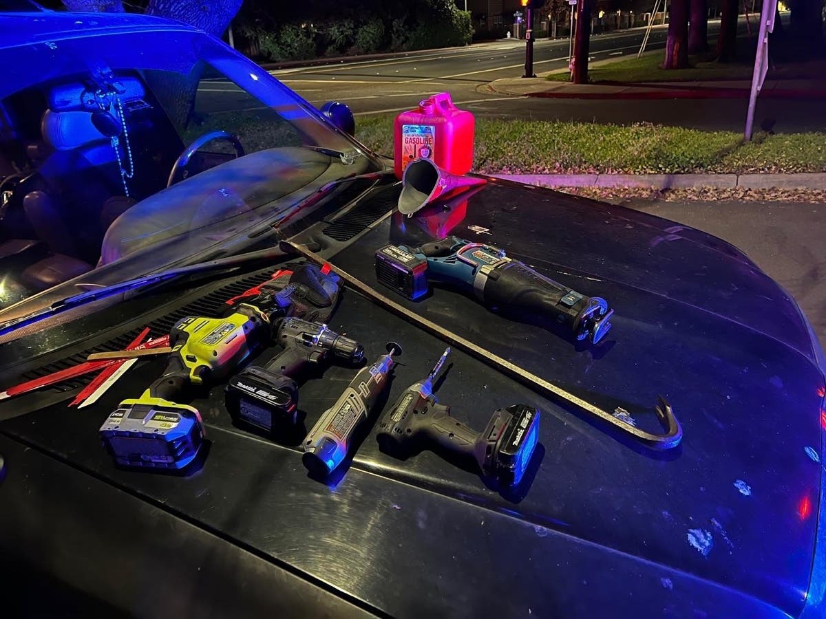 Police display the tools found in the stolen vehicle.