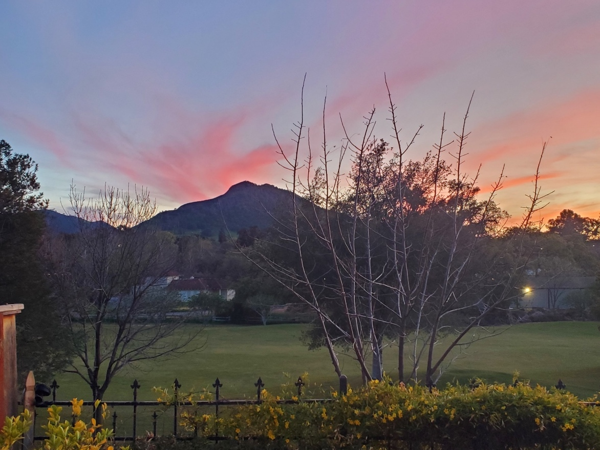 Clouds over Mt. Diablo are painted with the colors of sunset.