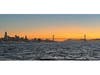 Sun setting over San Francisco, the Golden Gate Bridge and Marin. 