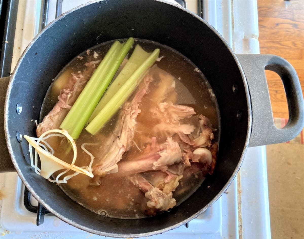The start of a pot of homemade turkey soup on the stove.