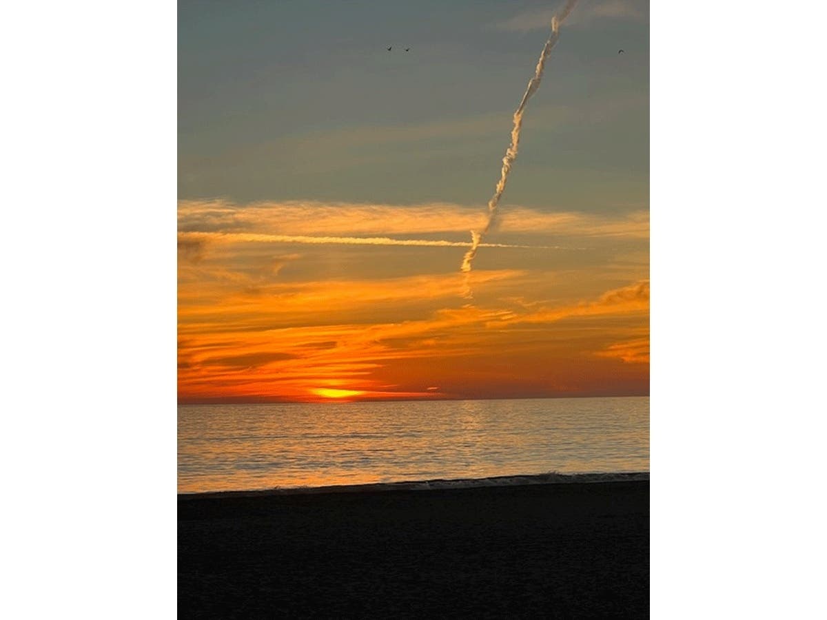 The final flash of sunlight as the sun sets over Monterey Bay in Aptos, Calif.