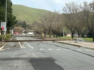 A PG&E power pole across Walnut Avenue in Fremont, Calif.