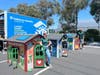 Prologis volunteers and their beautiful Habitat for Humanity playhouses.