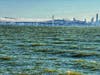 San Francisco Bay with the Bay Bridge and San Francisco in the distance.