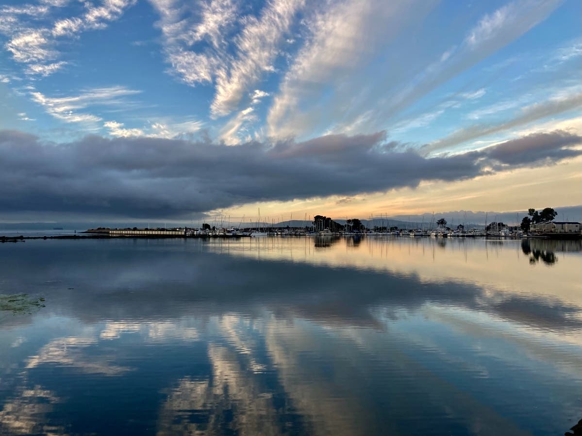 Clouds reflected in the water at Crown Harbor, Alameda, Calif.