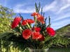 Carnations with freshly cut greenery.