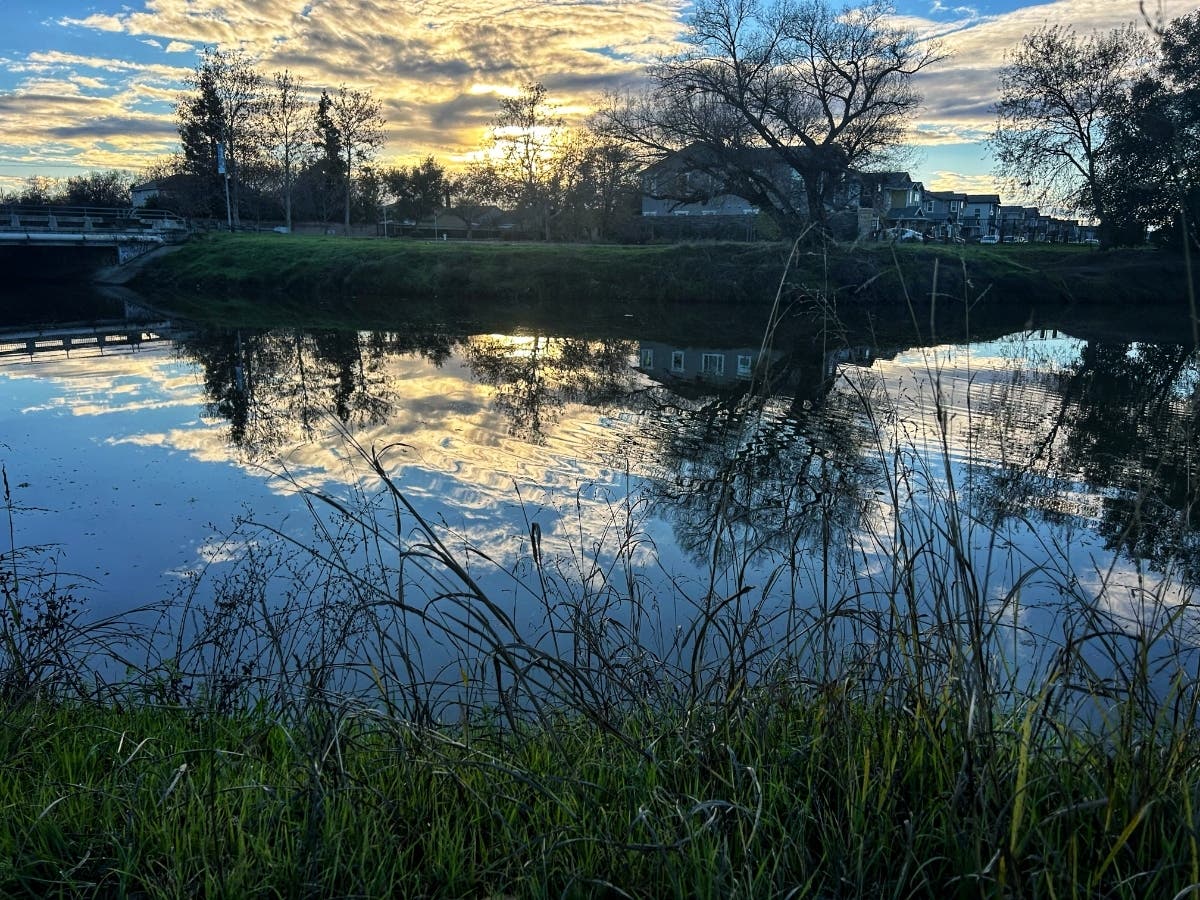 A beautiful sky is reflected in calm water in Sacramento, Calif.