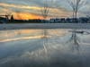 The clouds break enough to see sunset at Barandas Park in Sacramento, Calif.
