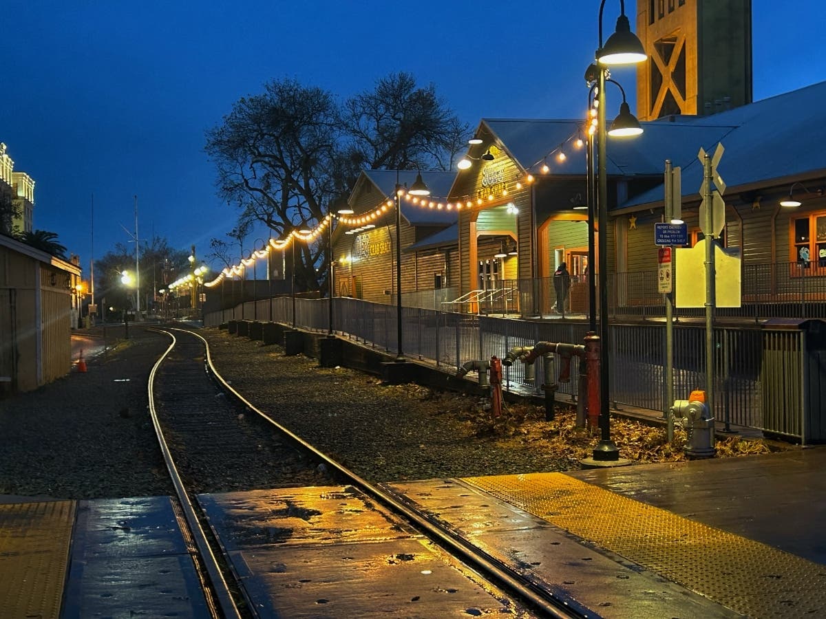 A nighttime photo of the train rails in Sacramento, Calif.