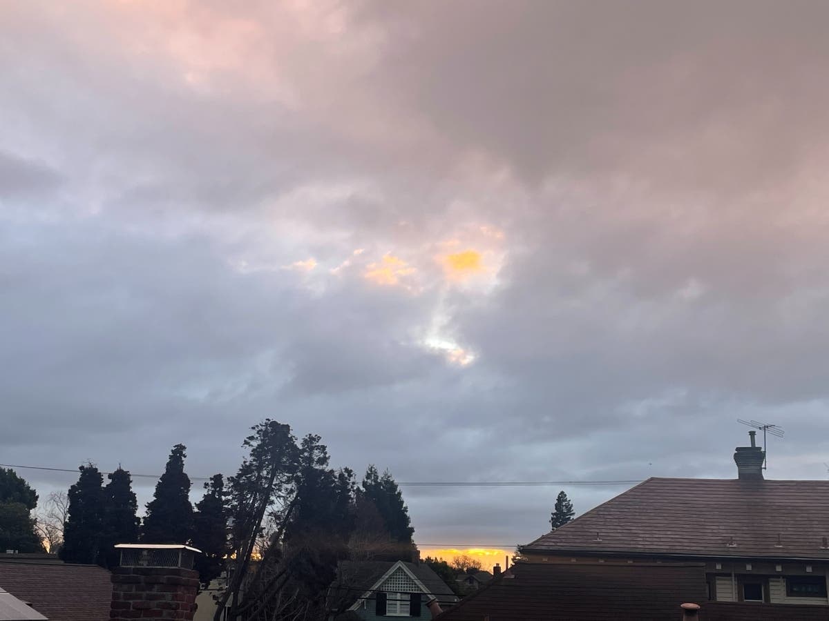 Hints of the sunrise break through Wednesday's cloud cover.