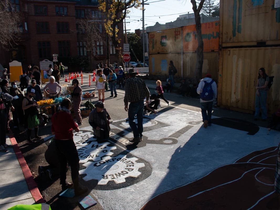 A group of people who oppose development at People's Park in Berkeley gathered to paint a mural on Bowditch Street on Feb. 11, 2024.
