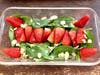 Spinach & Strawberry & Almond salad, with the spinach as the football turf, the strawberries as the lines down the middle for the 49ers & the goalposts, with the sliced almonds as various players on the field.