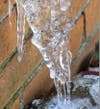 Yikes, this was frozen to a homeowner's eaves trough.