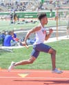 Junior Demairre Taylor runs the 4x100m Relay at Fulton County Championships