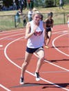 Junior Taylor McQuilken runs the 400m at the Fulton County Championships