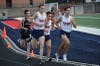 Junior Spencer Watry leads a group in the mile at a recent home meet