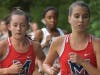 Junior Farrah Frith (left) & sophomore Ella Grace Malcom led the varsity girls to a 7th place team finish at the highly competitive Wingfoot XC Classic.