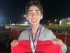 Freshman Justin Sevel with his awards after a 9th place finish in the freshman boys race at the 7th Wingfoot XC Classic in Cartersville