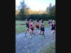 (l-r in red) Sophomore Ella Grace Malcom & Junior Farrah Frith midway through the girls varsity race at the Region 5-7A meet.